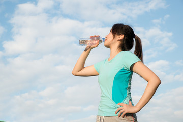 Sport Woman - Asian young woman drinking water during morning jo