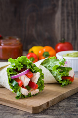 Mexican fajitas on wooden table

