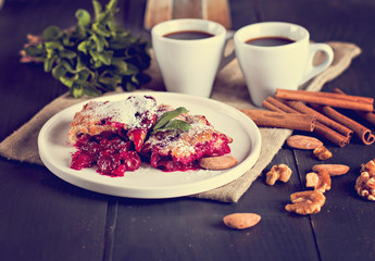 Cherry pie and a cup of coffee. Rustic style. Berry pie. Homemade cherry pie with flaky crust, cup of coffee, bowl with cherries