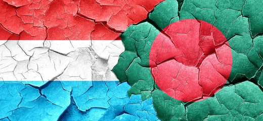 Luxembourg flag with Bangladesh flag on a grunge cracked wall