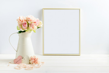 Mockup styled stock photograph of cream jug of flowers next to a Gold frame. You can place your business promotion, blog title, quote, headline or image in the frame.