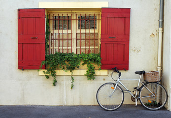 Fototapeta na wymiar bicycle and window in typical french village scene