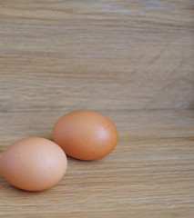 eggs. Fresh organic raw egg on a wooden backgroun.