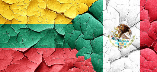 Lithuania flag with Mexico flag on a grunge cracked wall