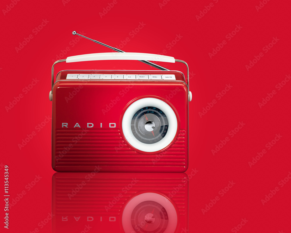 Wall mural red retro vintage radio with reflection on red