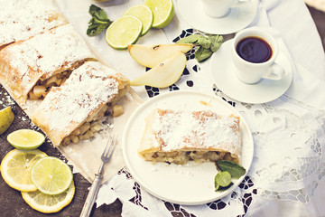 pie, strudel with pear and lemon. Cup of coffee. .Picnic, Breakfast in nature. Food in nature.