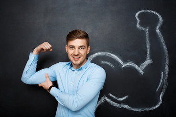 Picture of  funny man with  fake muscle arms