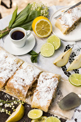 pie, strudel with pear and lemon. Cup of coffee. .Picnic, Breakfast in nature. Food in nature.