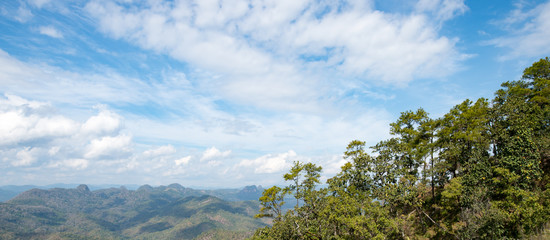 Mountains, trees, sky and cloud background. 