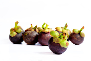 Mangosteens on white background.