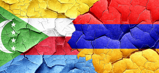 Comoros flag with Armenia flag on a grunge cracked wall