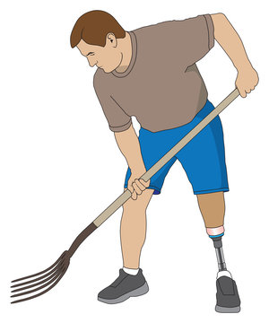 Left leg amputee using a pitchfork on a project