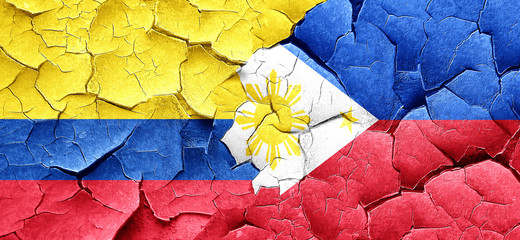 Colombia flag with Philippines flag on a grunge cracked wall