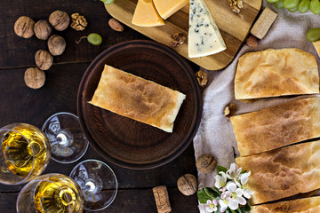 Сheese pie, strudel with cheese, cheese pie 4. Wine, grapes, nuts, cheese, blue cheese, and coffee. dinner, lunch, romantic date, picnic, eating on nature.