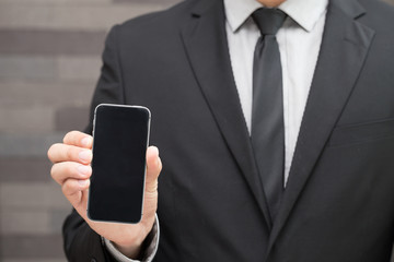 Businessman show mobile smartphone