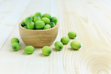 Lotus seed pod in wooden bowl