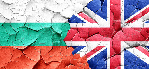 bulgaria flag with Great Britain flag on a grunge cracked wall