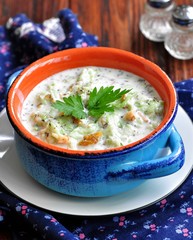 Cold summer soup from yogurt with cucumber, walnuts, raisins and mint