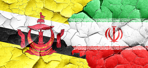 Brunei flag with Iran flag on a grunge cracked wall