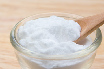 Baking soda (Sodiumbicarbonate) on wooden table 