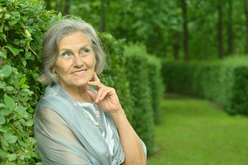 Fototapeta premium senior woman in summer park