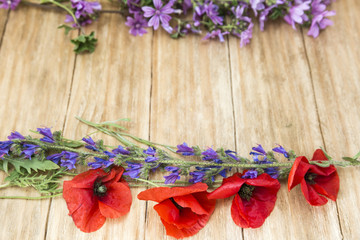 macro of red flowers in spring on a wooden table

