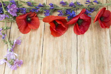 macro of red flowers in spring on a wooden table
