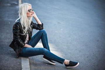 Fototapeta na wymiar Blonde cute model posing outdoors