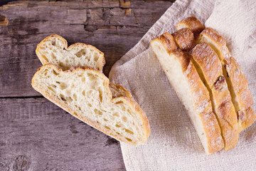 ciabatta, fresh bread, fresh ciabatta on the table. Italian ciabatta bread cut in slices.
