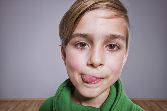 Boy With Tongue Out Licking His Lips, Funny Portrait