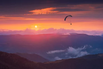 Foto op Plexiglas Luchtsport Against the sunset sky