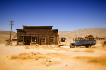 old farmhouse and truck in the desert of California