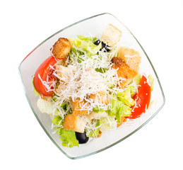 Delicious vegetable salad with croutons and cheese.