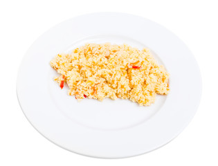 Delicious couscous porridge with tomatoes.