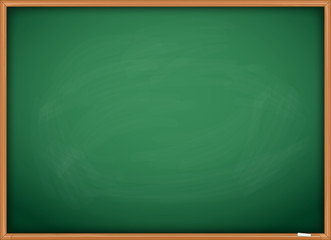Green chalkboard blackboard with chalk traces and wooden frame.   © denis_pc