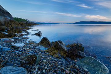 Fototapeta na wymiar Seascape with a stony shore, Norway