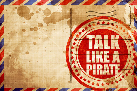 talk like a pirate, red grunge stamp on an airmail background