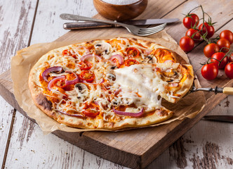 Homemade pizza with melted cheese