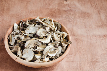 Dried porcini mushrooms on a wooden table. Rustic style.