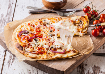 Homemade pizza with melted cheese