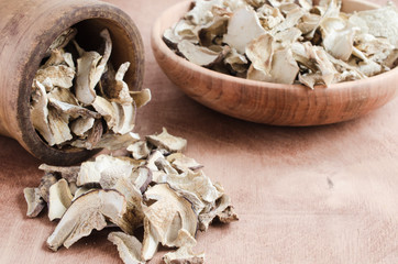 Dried porcini mushrooms on a wooden table. Rustic style.