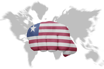 fist with the national flag of liberia on a world map background