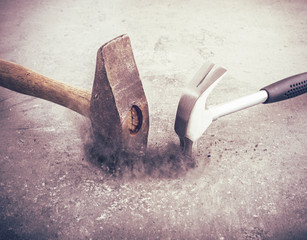 Two hammers hitting stone with strong force. Hammer still life. Symbol of strength and force. Concept of industrial work tool, carpentry equipment and DIY object. - 113565597