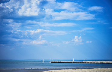 Obraz premium Pier at Nieuwpoort in Belgium / Sailing Ship at pier in North Sea