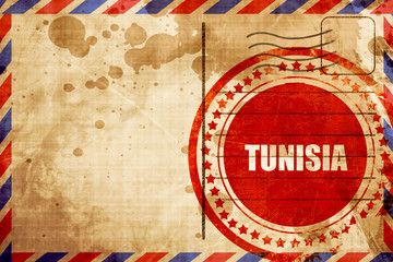 Greetings from tunisia, red grunge stamp on an airmail backgroun © Argus
