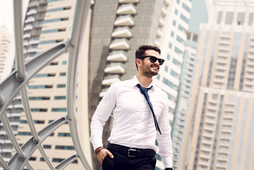 Businessman walking at big city.