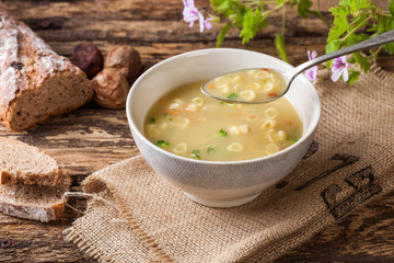 Vegetable soup on a rustic wooden table