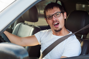 Male stupid face european driver is opening his mouth