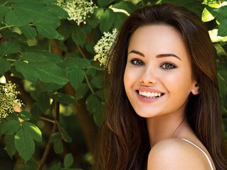 Obraz premium portrait of the young beautiful smiling woman outdoors