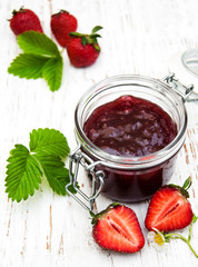 Strawberry jam and fresh strawberries